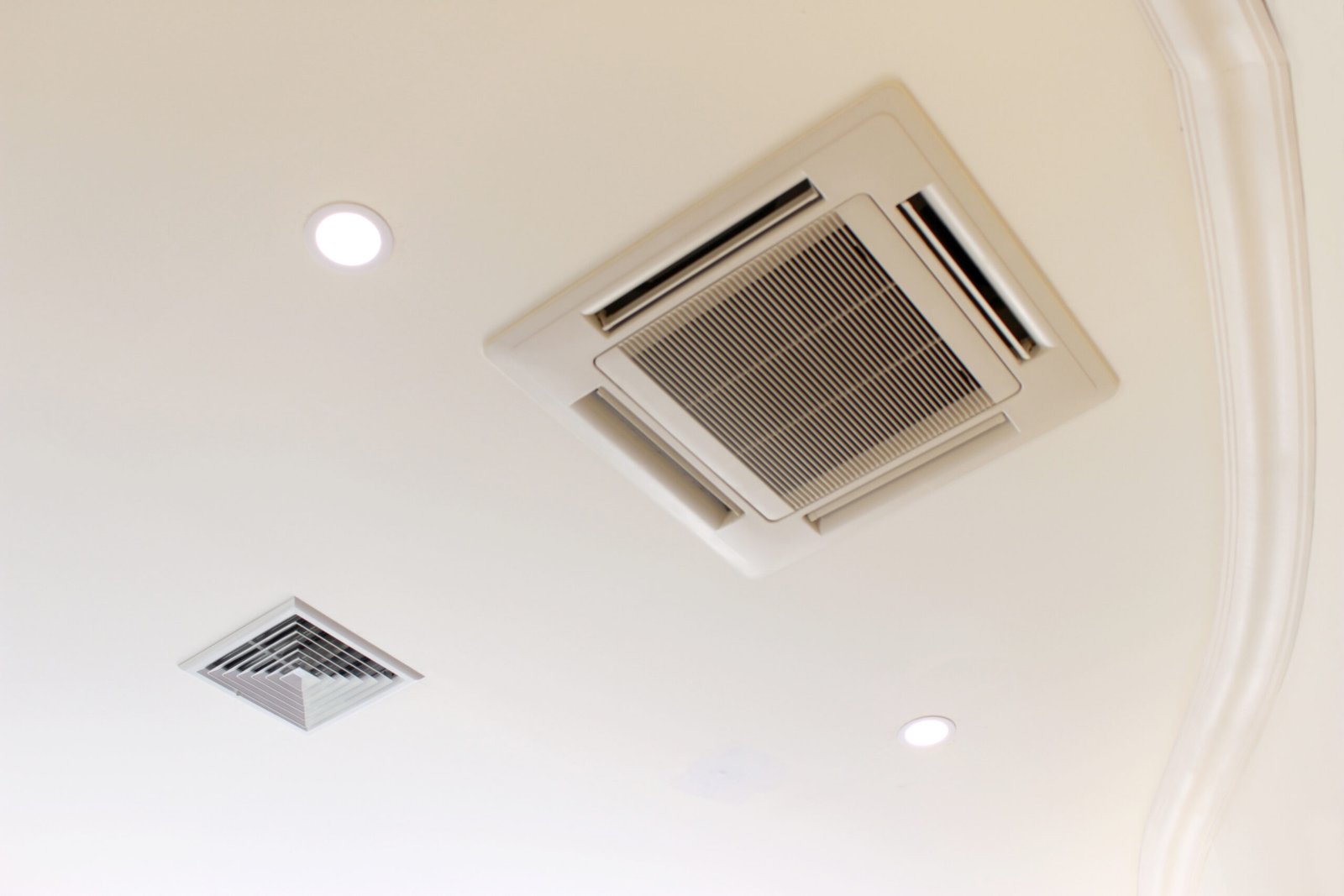 Air conditioner installed on the ceiling of a room